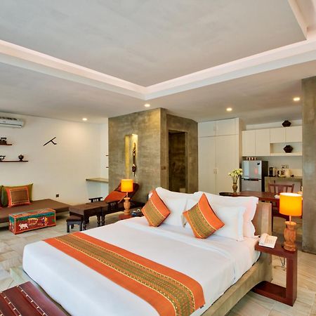 Mane Village Suites Siem Reap Exterior photo A bedroom at the hotel