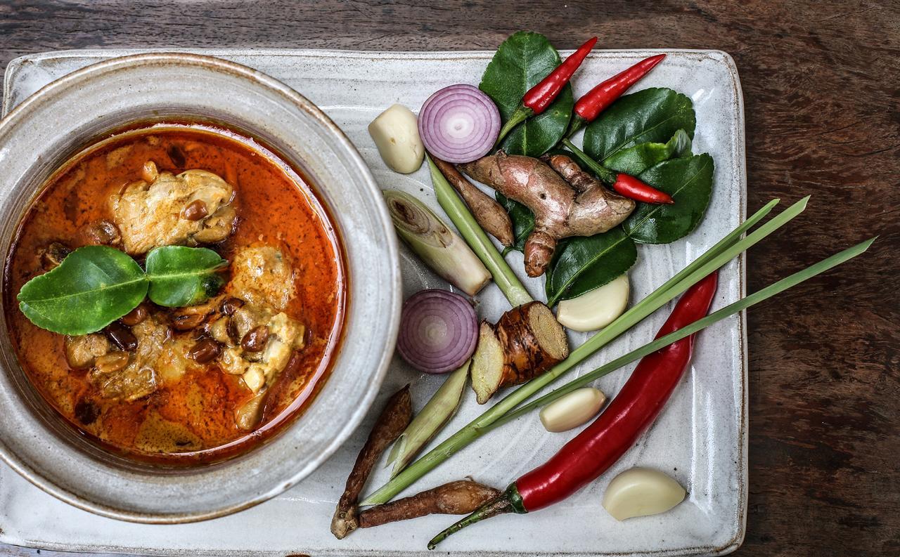Mane Village Suites Siem Reap Exterior photo Thai red curry with kaffir lime leaves, galangal, lemongrass, red chili, shallots, garlic, and kaffir lime