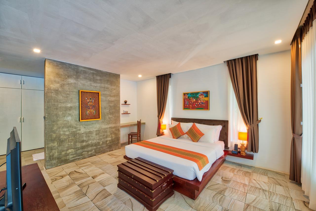 Mane Village Suites Siem Reap Exterior photo A bedroom at the hotel